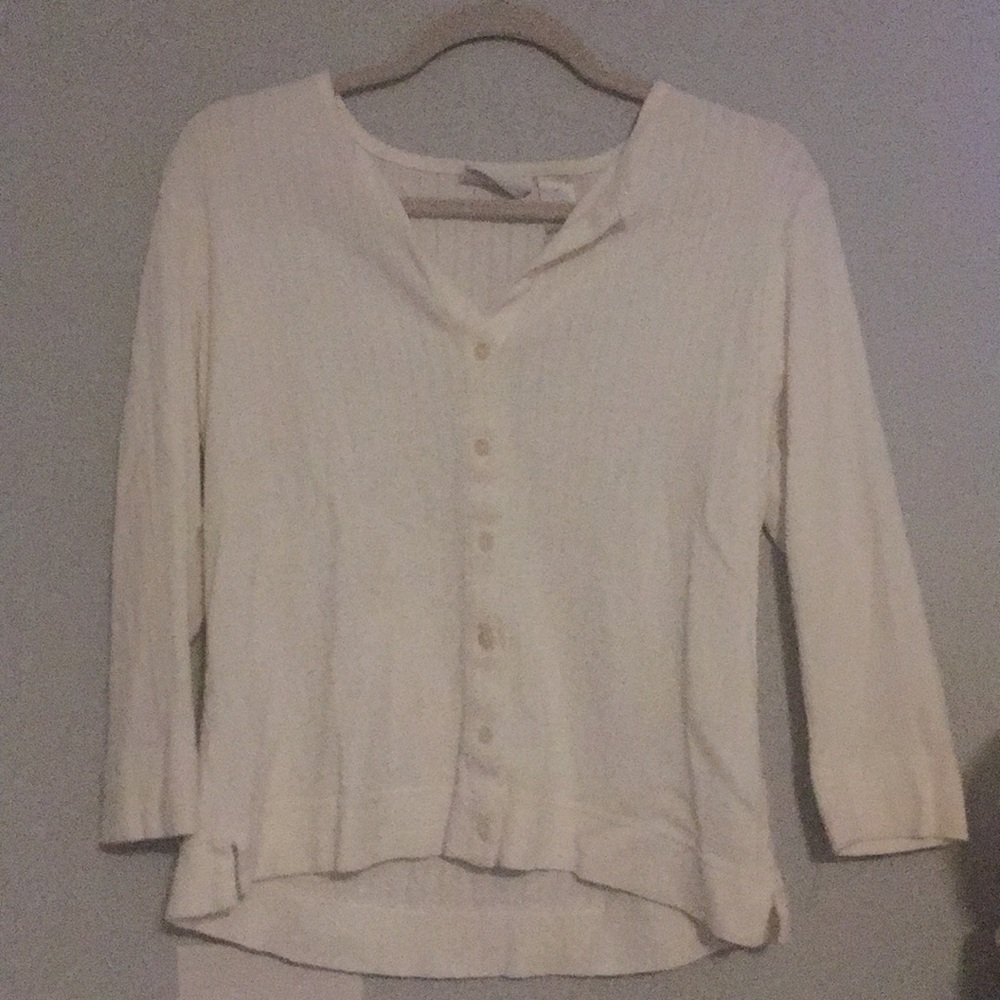 A cute cropped white cotton button up sweater